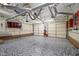 A spacious garage featuring epoxy floors, overhead storage racks, and plenty of workspace at 30079 Britt, Chapel Hill, NC 27514