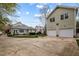 Large driveway featuring a two-car garage and a well-maintained yard and exterior at 30079 Britt, Chapel Hill, NC 27514