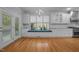 Bright kitchen featuring white cabinetry, subway tile backsplash, window seat and stainless steel appliances at 30079 Britt, Chapel Hill, NC 27514