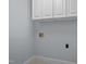Laundry room featuring washer and dryer hookups with ample space and convenient storage cabinets at 30079 Britt, Chapel Hill, NC 27514
