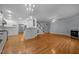 Open concept home featuring hardwood floors, stairs, kitchen and fireplace at 30079 Britt, Chapel Hill, NC 27514