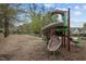 A colorful community playground, featuring slides and climbing structures, nestled amidst lush landscaping and greenery at 30079 Britt, Chapel Hill, NC 27514
