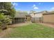A charming backyard with a screened-in porch, grassy area, and gravel landscaping at 306 Perry St, Raleigh, NC 27608