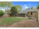 Large backyard with grass and screened porch, perfect for outdoor entertaining at 306 Perry St, Raleigh, NC 27608