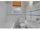 Well-lit bathroom with white subway tile and classic fixtures at 306 Perry St, Raleigh, NC 27608