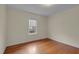 Bedroom with light tan walls, hardwood floors, and natural light at 306 Perry St, Raleigh, NC 27608