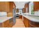 Charming kitchen with stainless steel appliances and ample wood cabinetry at 306 Perry St, Raleigh, NC 27608