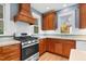 Stylish kitchen featuring wood cabinets, stainless steel appliances and natural lighting at 306 Perry St, Raleigh, NC 27608