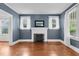 Cozy living room with hardwood floors and fireplace at 306 Perry St, Raleigh, NC 27608