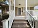 Inviting front porch with classic columns and steps leading to the entrance at 306 Perry St, Raleigh, NC 27608