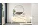 Hallway featuring a dresser with a round mirror and minimalist decor at 331 Deercroft Dr, Apex, NC 27539