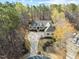 Stunning aerial view of the home showcasing its manicured landscaping, circular driveway, and wooded surroundings at 36 Wellspring Cir, Clayton, NC 27527