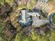 Overhead shot of the home's architecture, driveway layout, and private wooded lot, providing a sense of its scale at 36 Wellspring Cir, Clayton, NC 27527