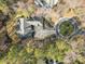 Stunning aerial view of property featuring lush greenery, a circular driveway, and ample parking at 36 Wellspring Cir, Clayton, NC 27527