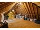 Spacious unfinished attic area ready for storage, featuring exposed beams and ample floor space at 36 Wellspring Cir, Clayton, NC 27527