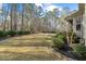 Well-maintained backyard with lush lawn, perfect for outdoor activities, complemented by mature trees and manicured shrubbery at 36 Wellspring Cir, Clayton, NC 27527