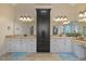 Bathroom featuring double vanity with granite countertops, large mirrors, and ample storage space at 36 Wellspring Cir, Clayton, NC 27527