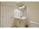 Bathroom featuring a toilet, vanity, framed mirror, and a well-lit space, perfect for comfort and convenience at 36 Wellspring Cir, Clayton, NC 27527