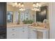 Close up of a bright bathroom featuring granite counters, vanity, lots of light and lots of storage at 36 Wellspring Cir, Clayton, NC 27527