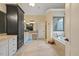 Bright bathroom with a large vanity, storage, soaking tub, and tiled floors, offering a spa-like experience at 36 Wellspring Cir, Clayton, NC 27527