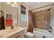 Bathroom showcasing a tiled shower/tub, a framed mirror, and a white vanity with a marble countertop at 36 Wellspring Cir, Clayton, NC 27527