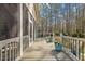 Spacious deck area with railing and flower pots, offering a delightful space for outdoor entertaining at 36 Wellspring Cir, Clayton, NC 27527