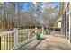 Large deck with white railings and beautiful landscaping, perfect for outdoor gatherings and relaxation at 36 Wellspring Cir, Clayton, NC 27527