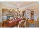 Dining room boasts archways, coffered ceilings, chandelier, and natural light at 36 Wellspring Cir, Clayton, NC 27527