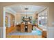 Dining room with coffered ceiling and an elegant chandelier over the dining table at 36 Wellspring Cir, Clayton, NC 27527