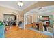 Elegant dining room with hardwood floors, coffered ceiling, and views to the living room at 36 Wellspring Cir, Clayton, NC 27527