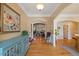Inviting entryway featuring hardwood floors, elegant archways, and a stylish turquoise buffet at 36 Wellspring Cir, Clayton, NC 27527