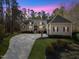 Charming home featuring manicured landscaping, brick accents, and a spacious driveway at 36 Wellspring Cir, Clayton, NC 27527