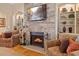 Close-up of a stone fireplace with built-in shelves in the living room at 36 Wellspring Cir, Clayton, NC 27527