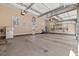 Oversized garage with high ceilings, offering plenty of space for parking and storage, with unique wall decor at 36 Wellspring Cir, Clayton, NC 27527