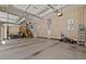 Generous garage space with multiple car capacity, featuring high ceilings and bonus storage or workshop area at 36 Wellspring Cir, Clayton, NC 27527