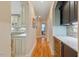Hallway with hardwood floors and access to kitchen and living area, offering seamless transitions at 36 Wellspring Cir, Clayton, NC 27527