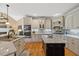 Well-appointed kitchen featuring island, granite counters, and stainless steel appliances at 36 Wellspring Cir, Clayton, NC 27527