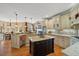 Updated kitchen with island, stainless appliances, and open layout at 36 Wellspring Cir, Clayton, NC 27527