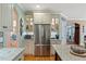 Well-equipped kitchen featuring stainless steel refrigerator and abundant counter space with hardwood floors at 36 Wellspring Cir, Clayton, NC 27527