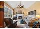 Cozy living room featuring vaulted ceiling, fireplace, and large windows with natural light at 36 Wellspring Cir, Clayton, NC 27527