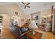 Inviting living room features a stone fireplace, vaulted ceilings, and comfortable seating at 36 Wellspring Cir, Clayton, NC 27527