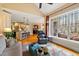 Bright living room with a view of the backyard, hardwood floors and adjacent kitchen area at 36 Wellspring Cir, Clayton, NC 27527