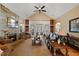 Open living room featuring fireplace, hardwood floors, and a cozy seating area at 36 Wellspring Cir, Clayton, NC 27527