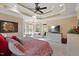 Bright main bedroom offering a ceiling fan, sitting area and an attached bath for a private retreat at 36 Wellspring Cir, Clayton, NC 27527