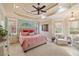 Luxurious main bedroom boasts tray ceilings, plush carpet, and abundant natural light from large windows at 36 Wellspring Cir, Clayton, NC 27527