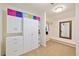 Spacious walk-in closet with built-in shelves, cabinets, and ample hanging space for organized storage at 36 Wellspring Cir, Clayton, NC 27527