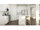 Clean and bright kitchen with white cabinets, stainless steel appliances, and a kitchen island at 4016 Shadbush St, Raleigh, NC 27616