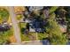 This aerial view captures the home, surrounded by a verdant landscape of trees, offering a sense of seclusion at 508 Currituck Dr, Raleigh, NC 27609
