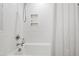 Bathroom featuring a tiled shower with built in niche and a shower curtain at 508 Currituck Dr, Raleigh, NC 27609
