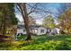 This exterior shot highlights the home's layout, featuring a playset, a patio, and an external building at 508 Currituck Dr, Raleigh, NC 27609